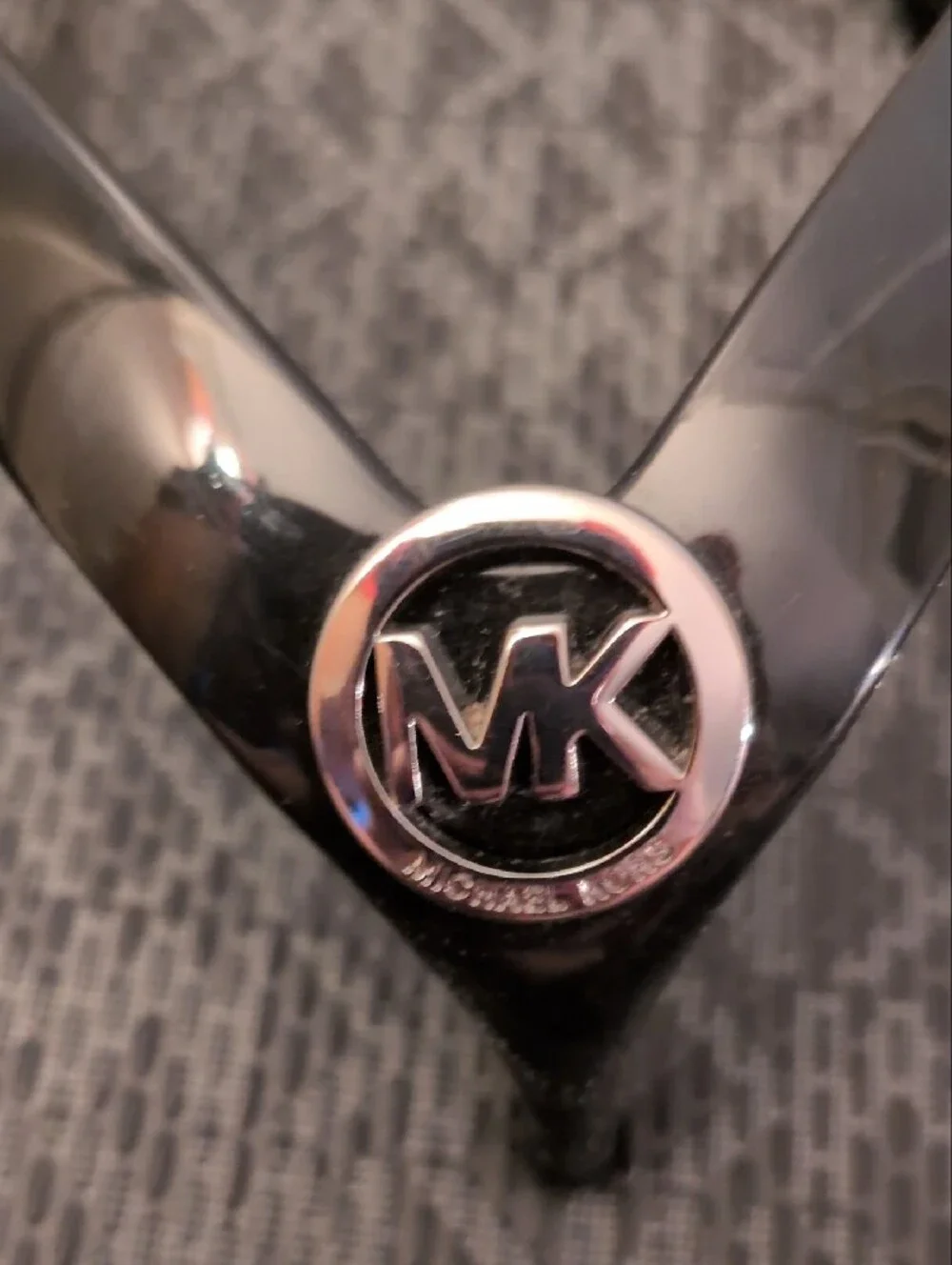 Michael Kors Black Logo Monogram Flip Flops with Silver MK Medallions.